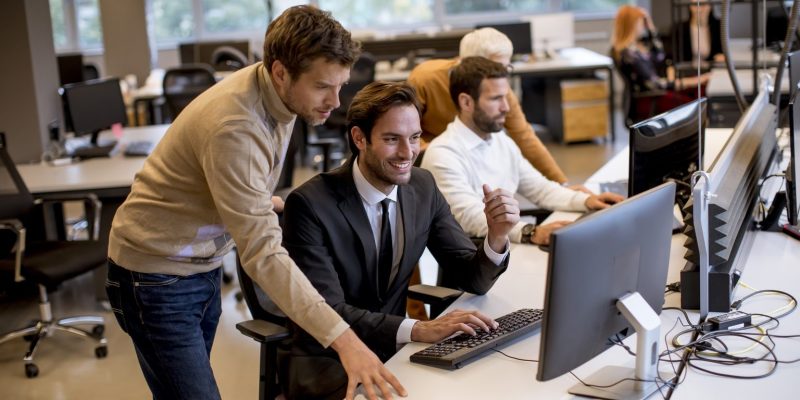 senior-businesswoman-young-business-people-work-modern-office-1536x1024